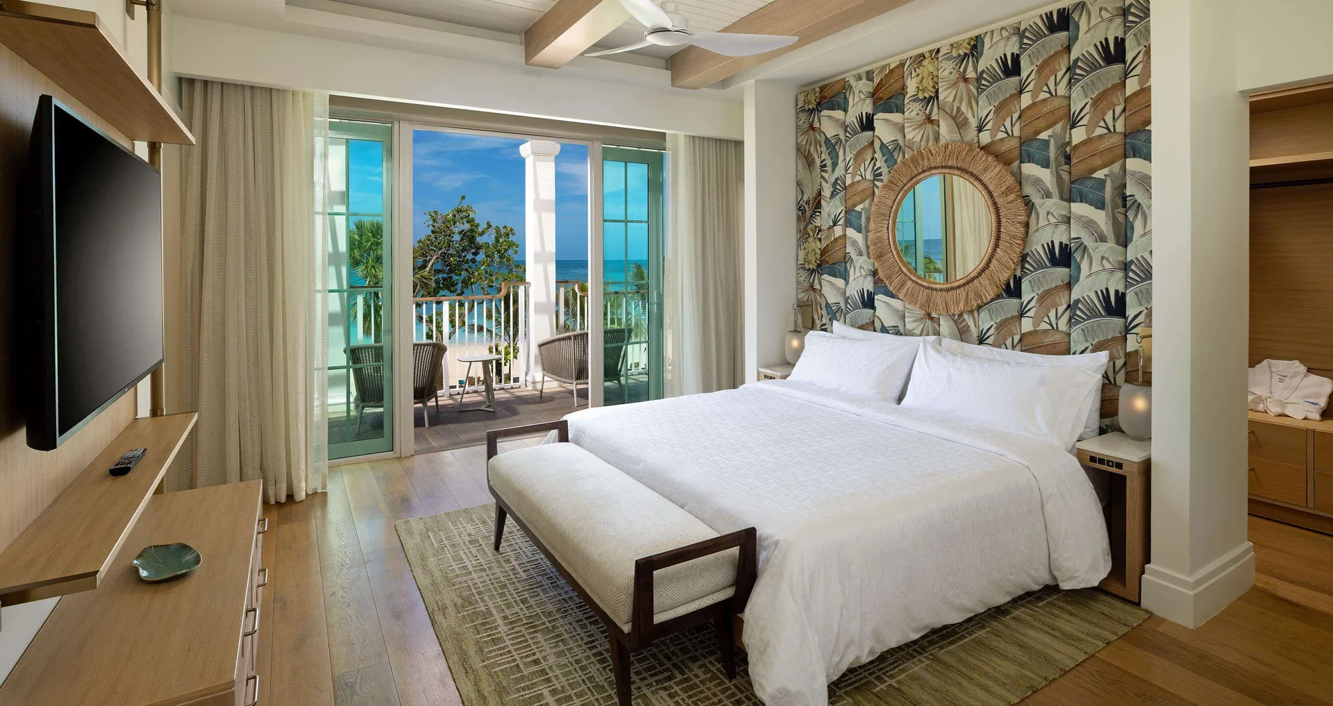 King bedroom with balcony and ocean view in Firesky Reserve Villa at Beaches Negril Resort.