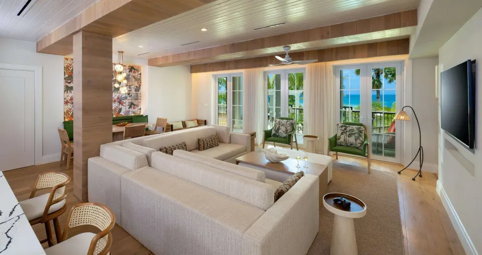 Living room with ocean-facing doors in Firesky Reserve Villa at Beaches Negril Resort.