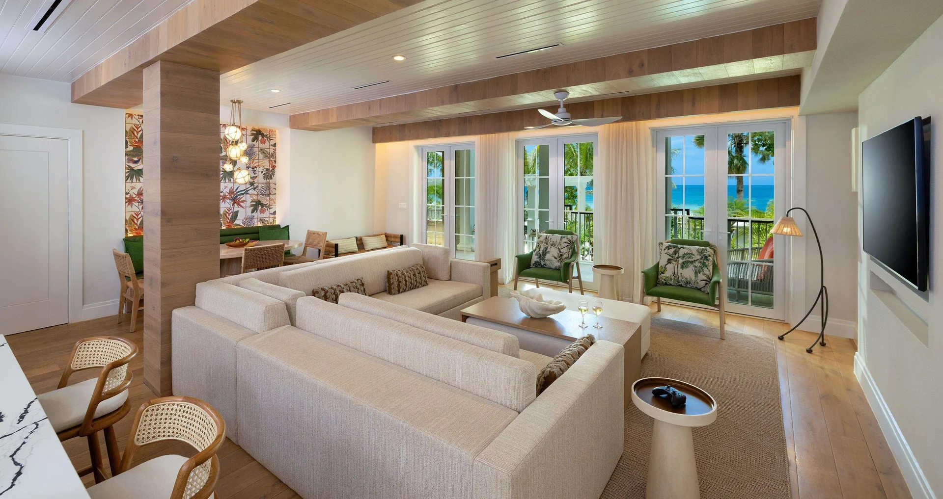 Living room with ocean-facing doors in Firesky Reserve Villa at Beaches Negril Resort.