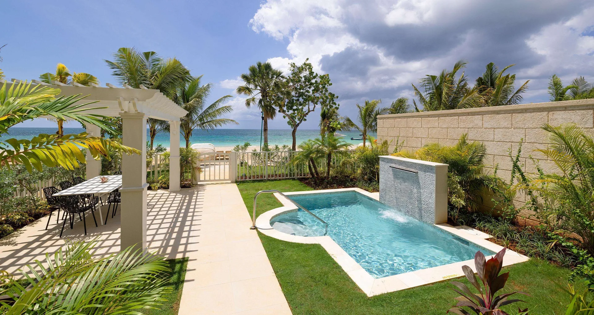 Private plunge pool and oceanfront patio at Firesky Reserve Villa at Beaches Negril Resort.