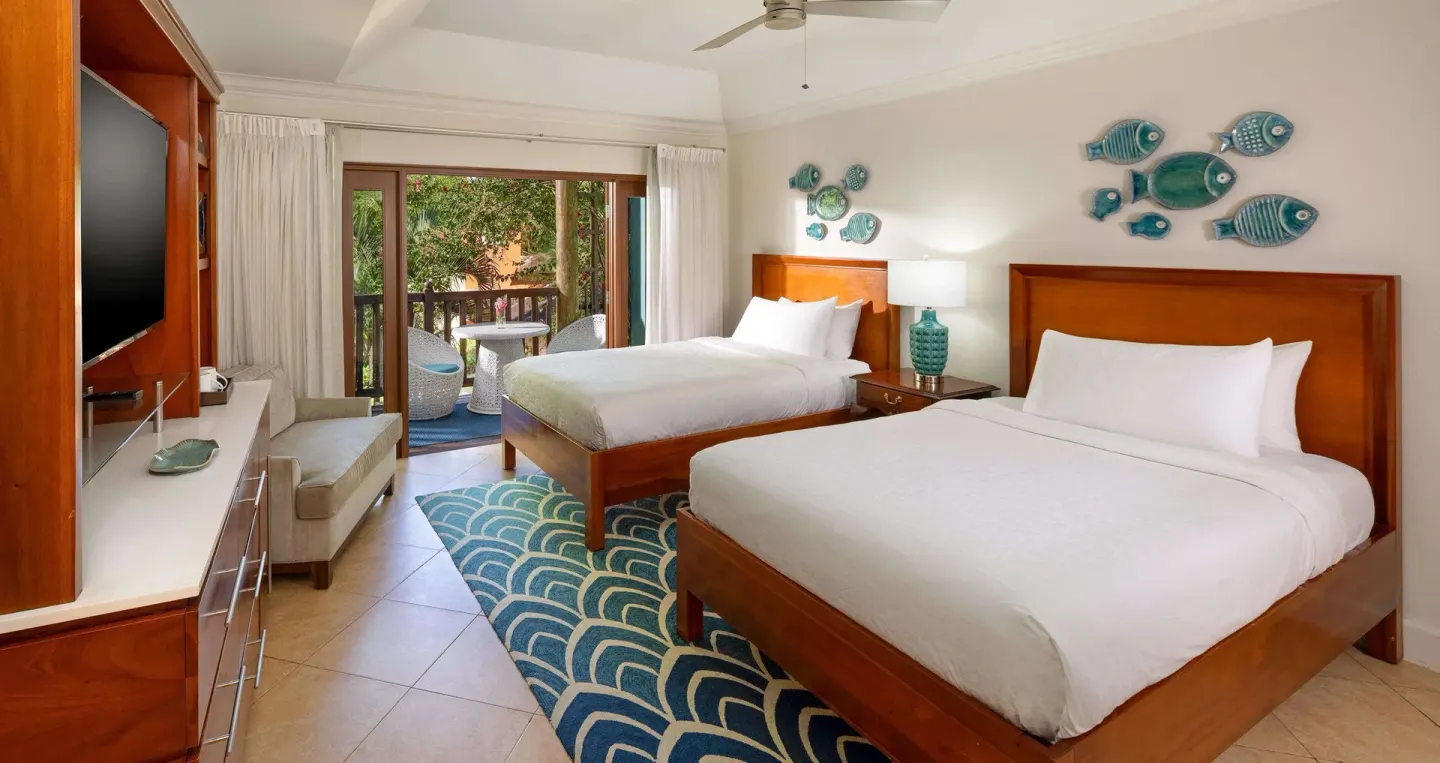 Luxury garden view room with two beds and balcony at Beaches Negril Resort.