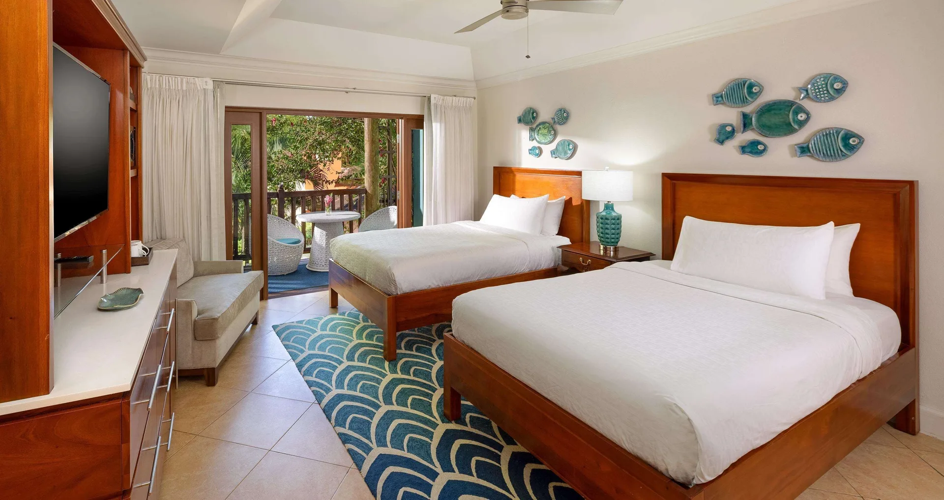 Luxury garden view room with two beds and balcony at Beaches Negril Resort.