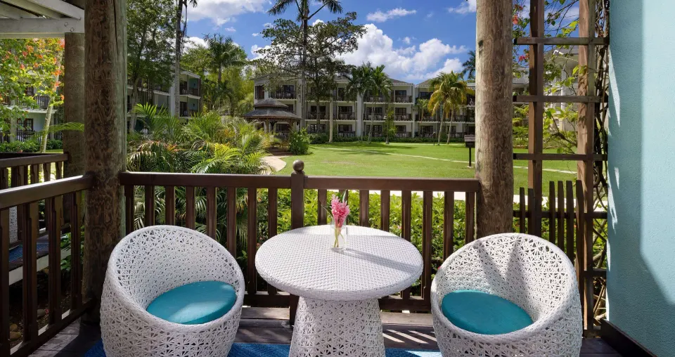 Furnished patio overlooking gardens at Beaches Negril Resort.
