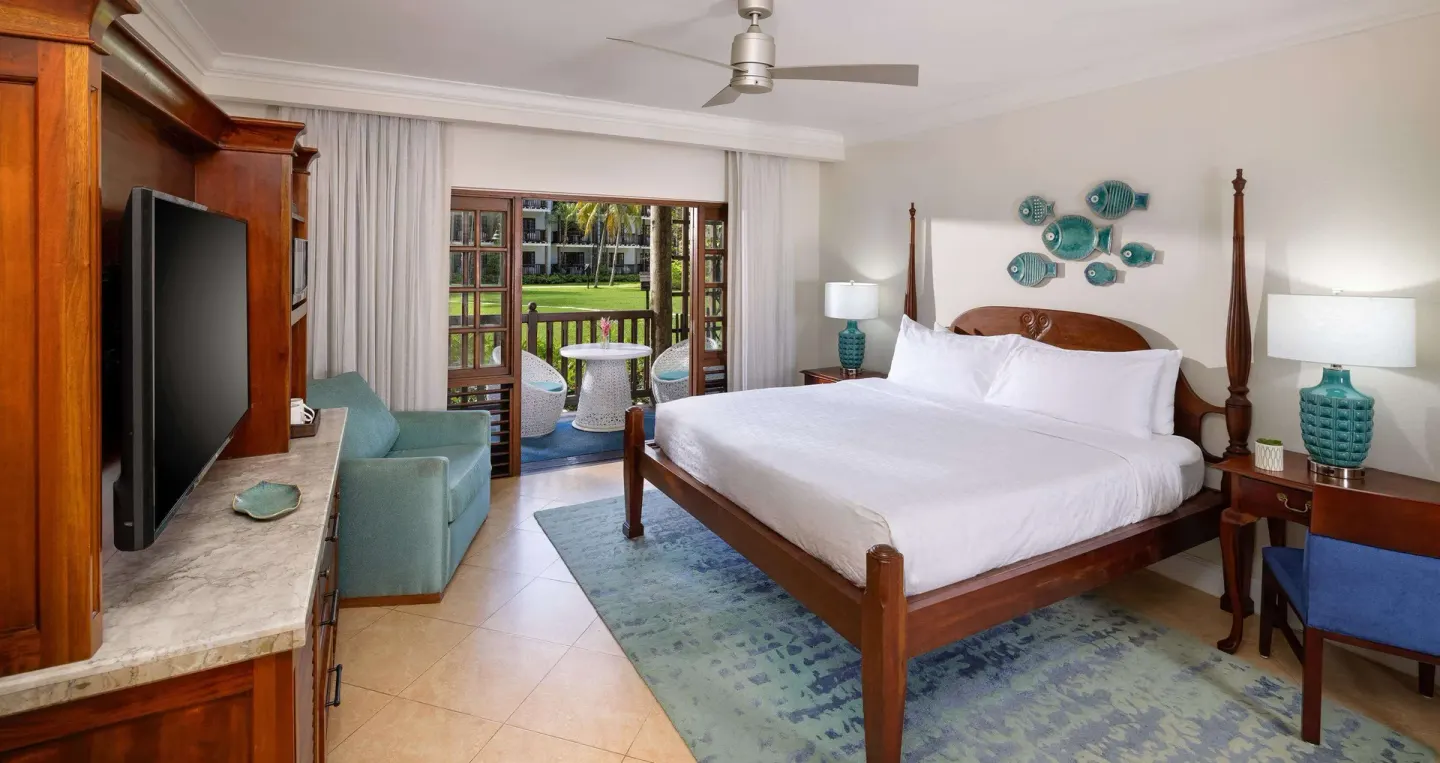 Luxury Room king bed and patio doors at Beaches Negril Resort.