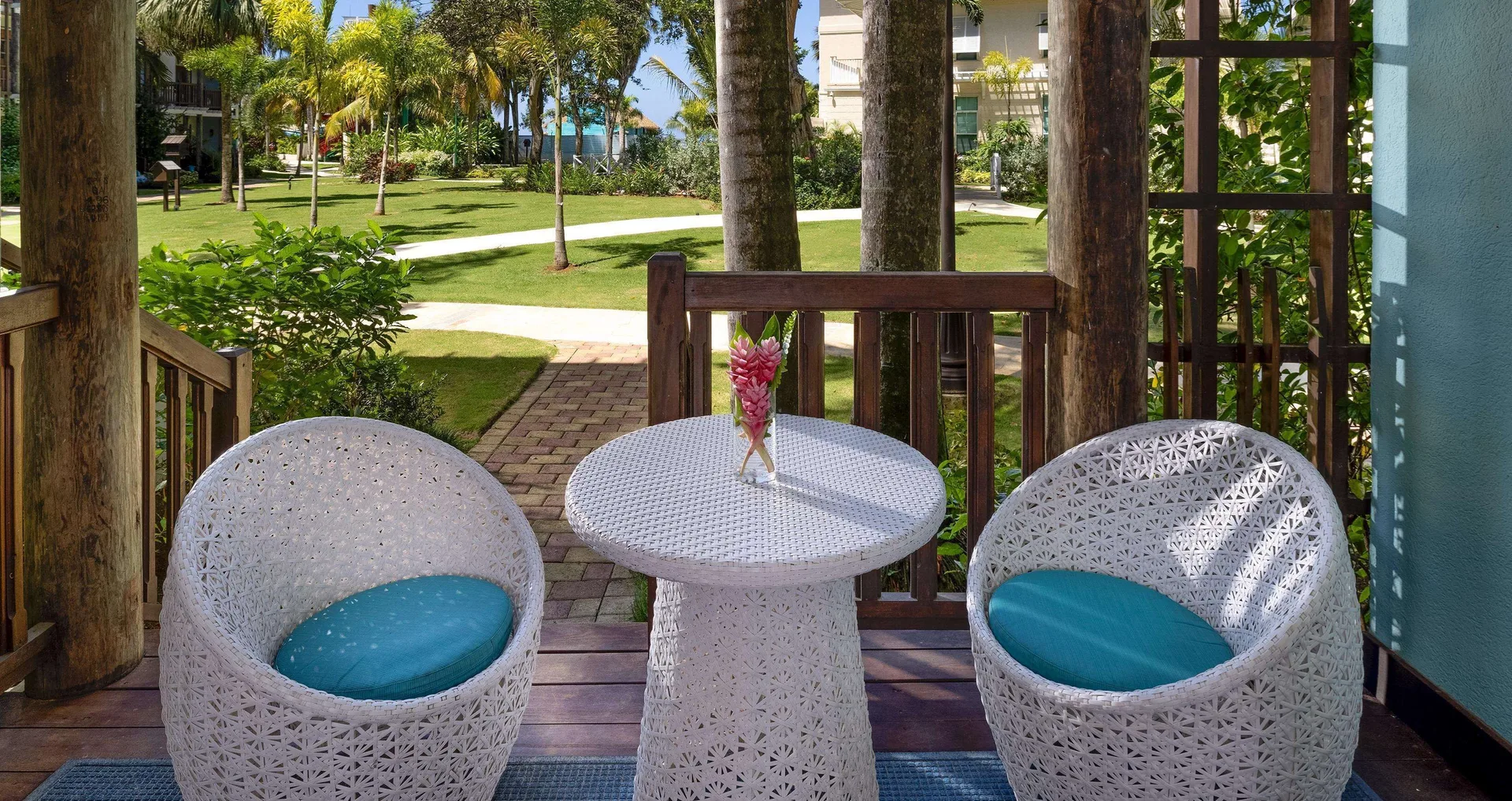 Room 1 Bedroom Ocean View Tropical Walkout Concierge at Beaches Negril Resort with patio seating and direct oceanview access.