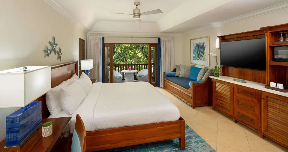 Tropical Concierge room with king bed, daybed, and balcony at Beaches Negril Resort.