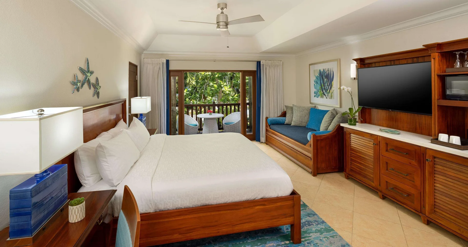 Room 1 Bedroom Partial Ocean View Tropical Oceanview Concierge at Beaches Negril Resort with king bed, daybed, and partial oceanview light.
