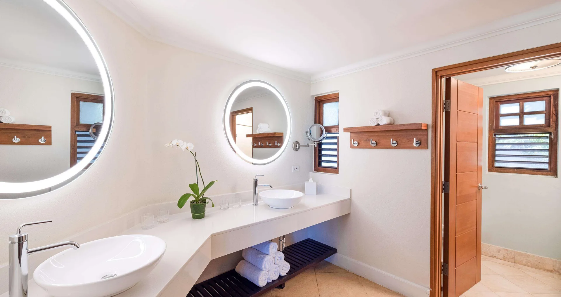 Bathroom vanity with two vessel sinks in a Tropical Concierge Family Suite at Beaches Negril Resort.