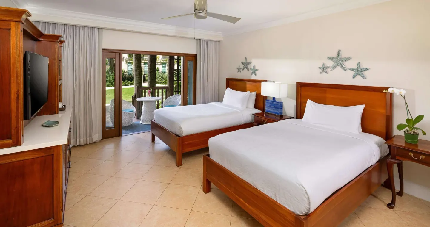 Tropical Oversized Concierge Suite with two beds and patio at Beaches Negril Resort.