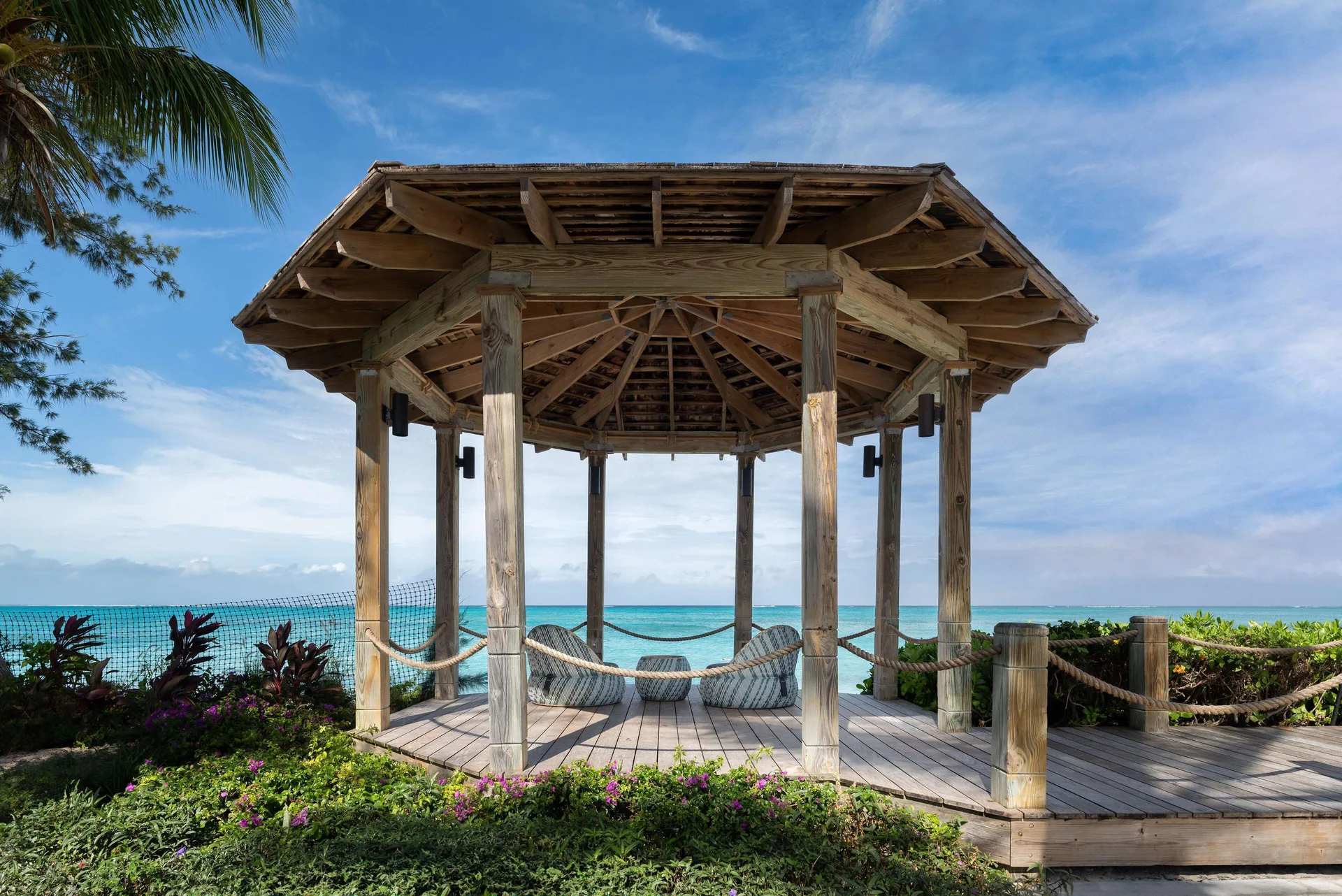 Wooden beachfront pavilion with cushioned seating at Beaches Turks & Caicos.