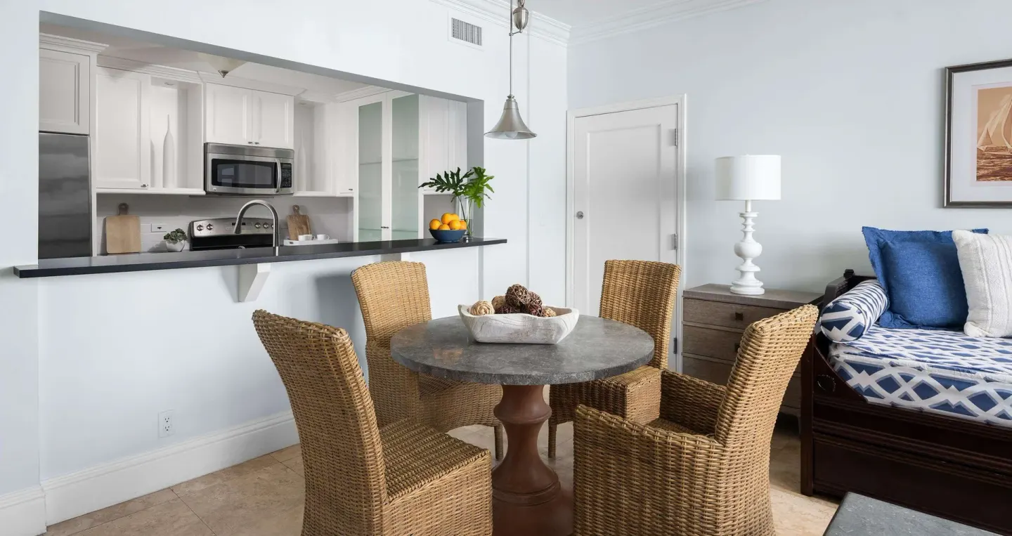 Suite dining table and kitchen pass-through at Beaches Turks & Caicos.