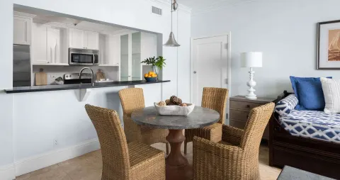 Suite dining table and kitchen pass-through at Beaches Turks & Caicos.
