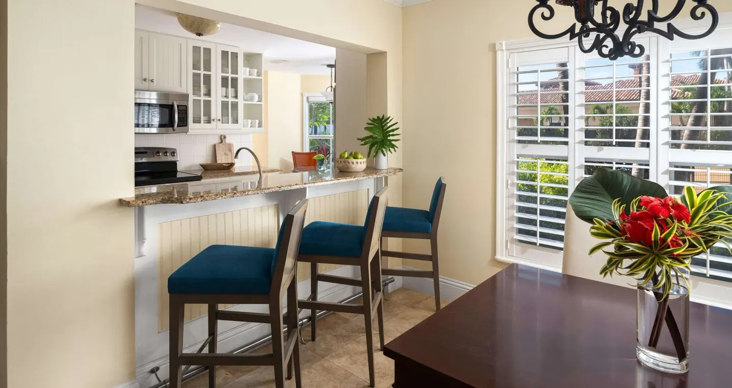 Breakfast bar, kitchen pass-through, and dining table at Beaches Turks & Caicos.