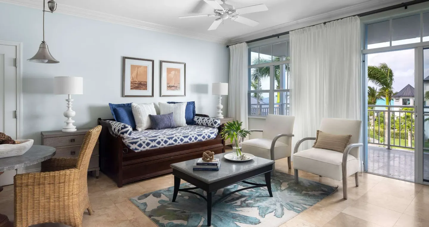Living area with daybed and balcony doors at Beaches Turks & Caicos.