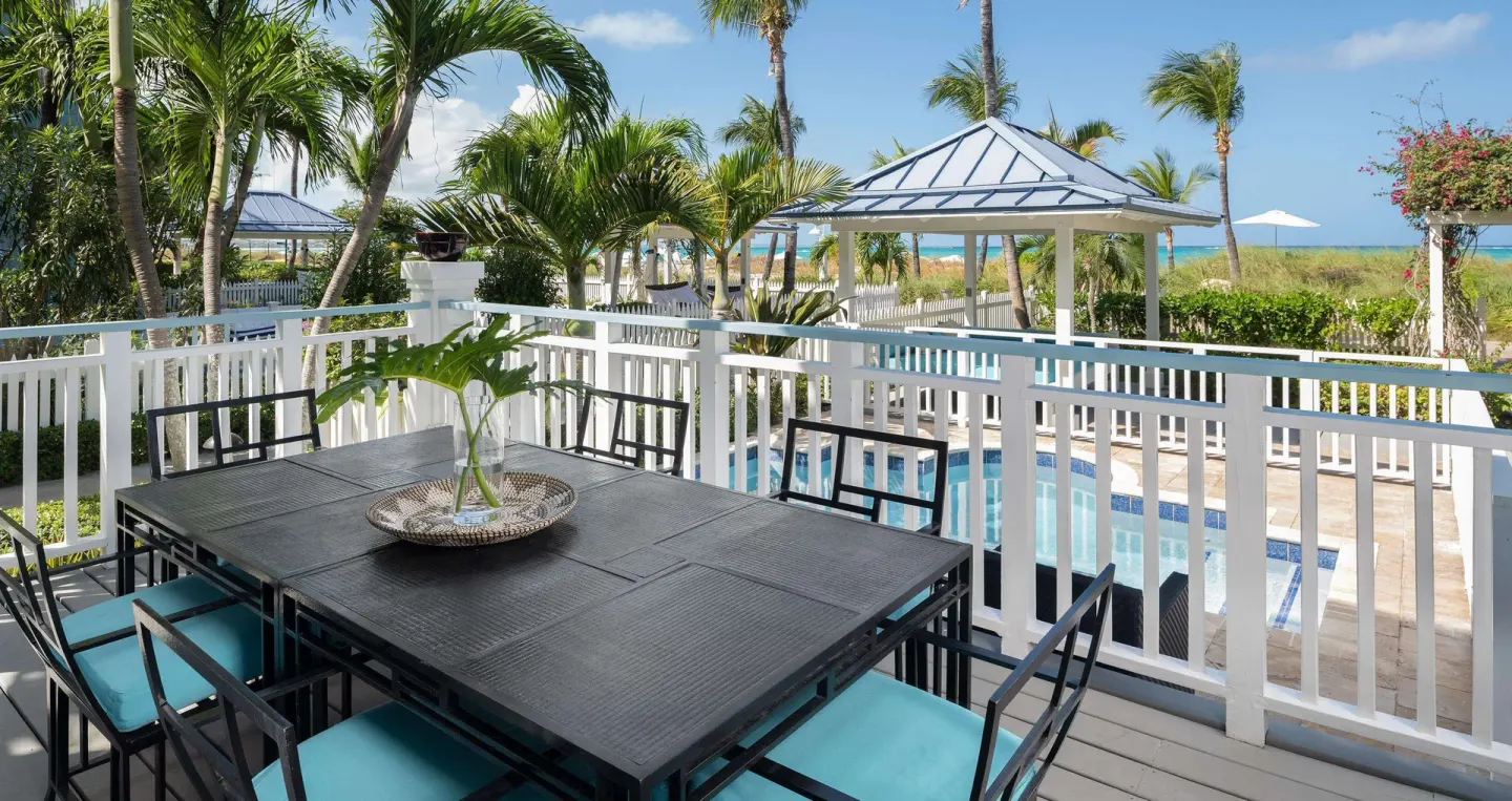 Terrace dining table overlooking a private pool at Beaches Turks & Caicos.