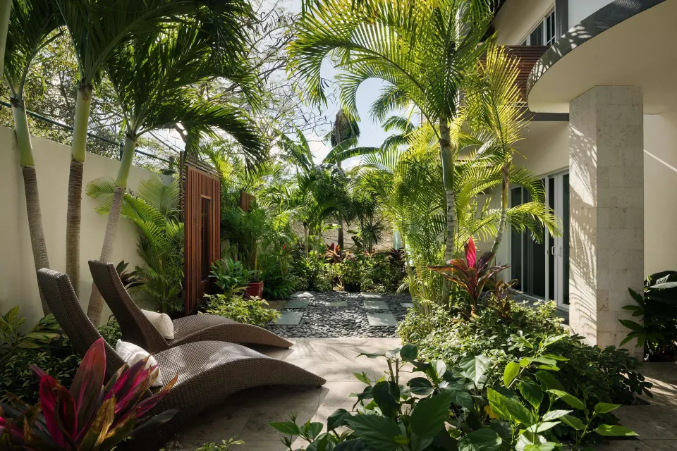 Private tropical patio with lounge chairs at Beaches Turks & Caicos.