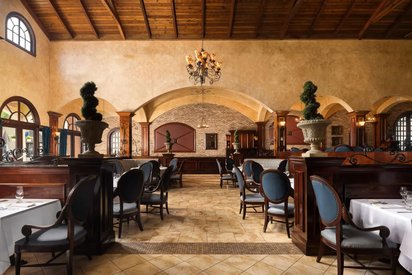Elegant dining room with arches and wood ceiling at Beaches Turks & Caicos.