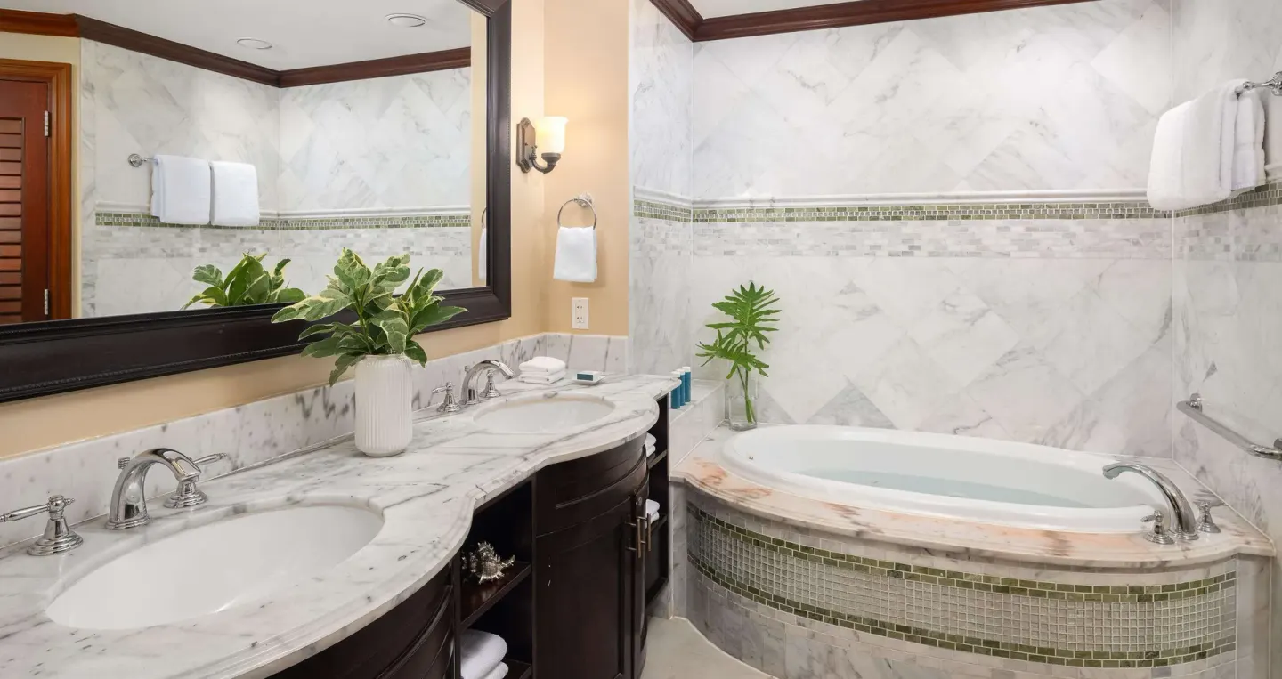 Marble bathroom with double vanity and soaking tub at Beaches Turks & Caicos.