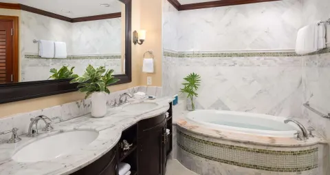 Marble bathroom with double vanity and soaking tub at Beaches Turks & Caicos.