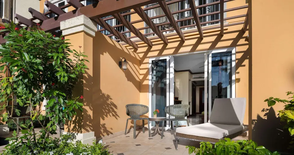 Garden walkout patio with lounge chair and seating at Beaches Turks & Caicos.