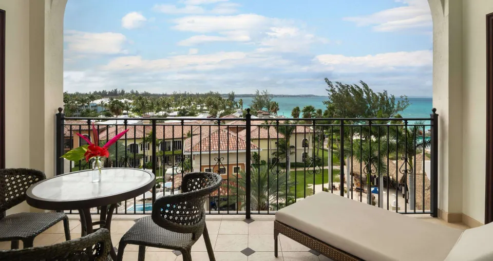 Private balcony with seating and ocean view at Beaches Turks & Caicos.