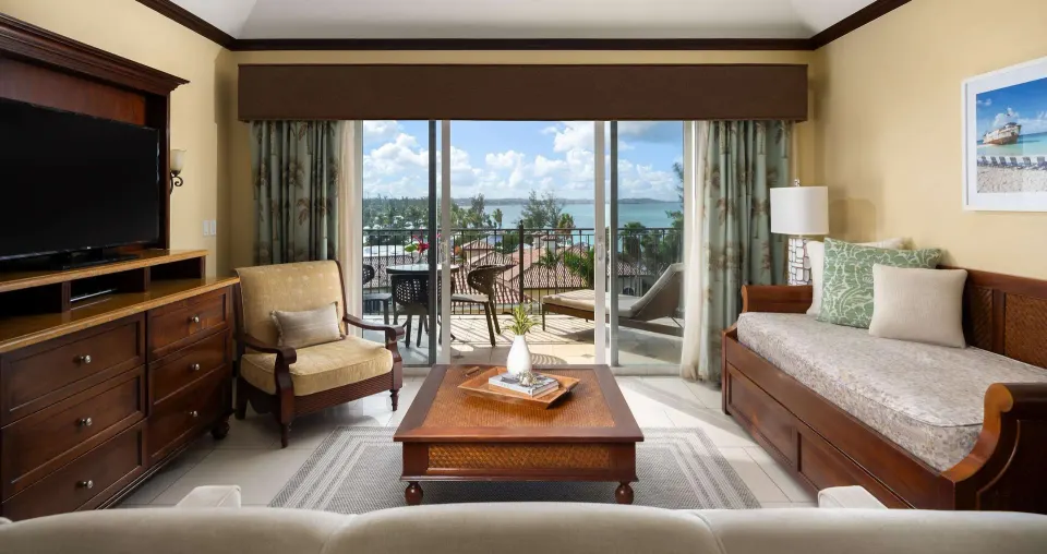 Ocean-view family suite living room with balcony at Beaches Turks & Caicos.