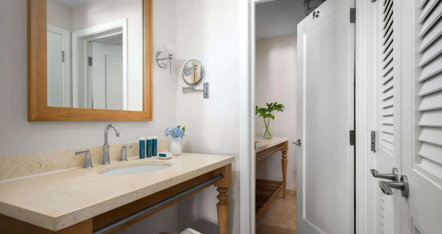 Bathroom vanity with mirror and bath amenities at Beaches Turks & Caicos.