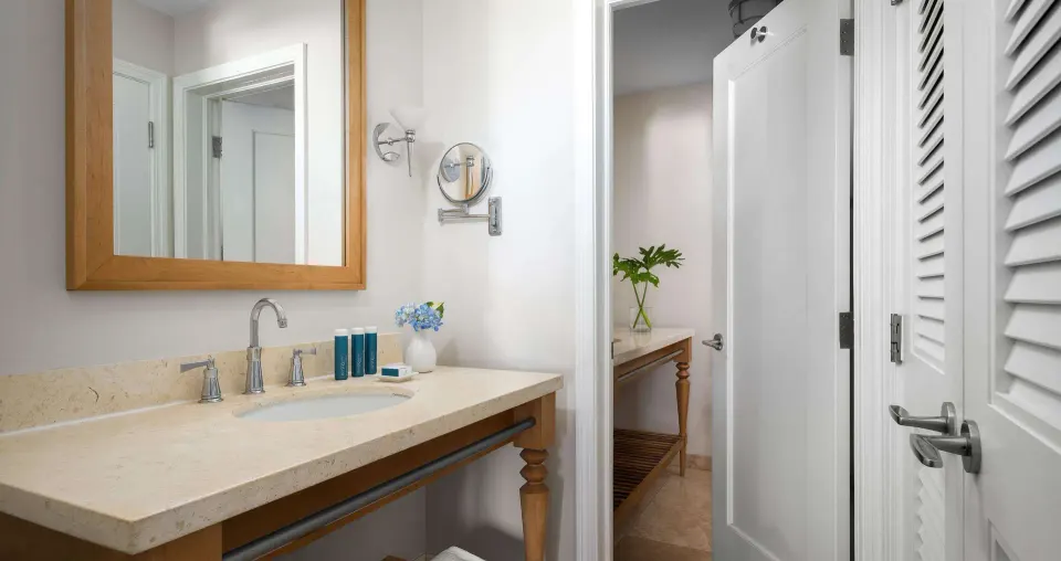 Bathroom vanity with mirror and bath amenities at Beaches Turks & Caicos.