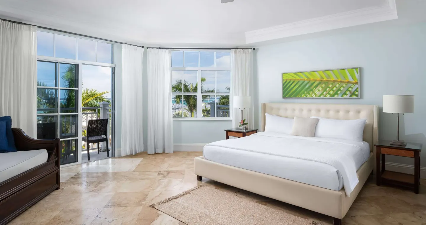 King bed and seating area in a garden-view room at Beaches Turks & Caicos.