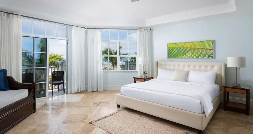 King bed and seating area in a garden-view room at Beaches Turks & Caicos.