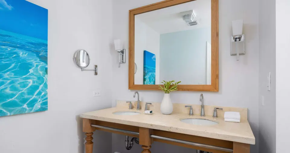 Double-sink bathroom vanity with large mirror at Beaches Turks & Caicos.