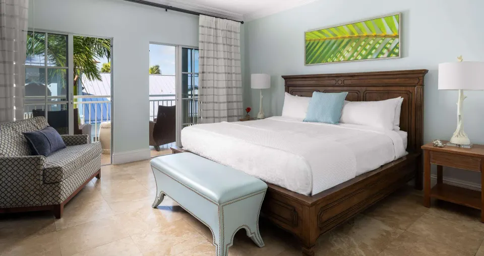Luxury garden-view room with king bed and balcony doors at Beaches Turks & Caicos.