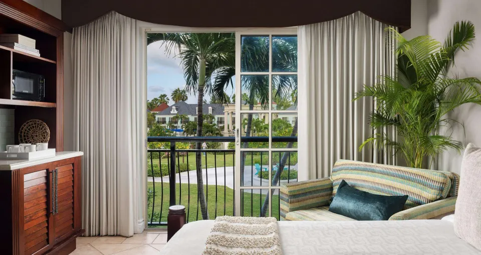 Luxury Room Garden View balcony scene from the bed at Beaches Turks & Caicos.
