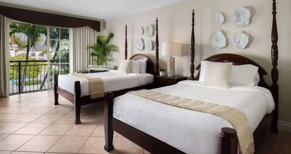 Luxury Room Garden View with two four-poster beds at Beaches Turks & Caicos.