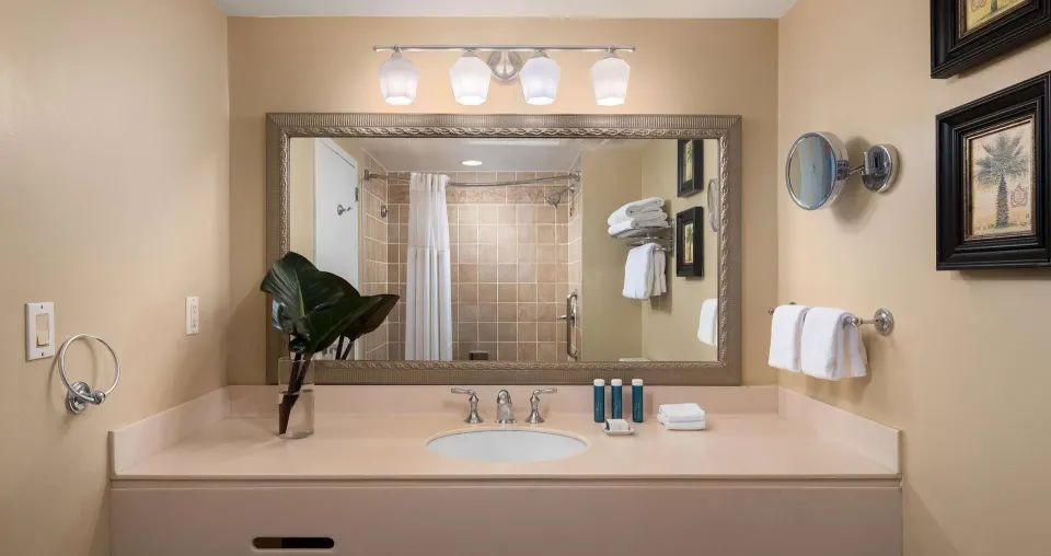 Standard room bathroom vanity and shower at Beaches Turks & Caicos.