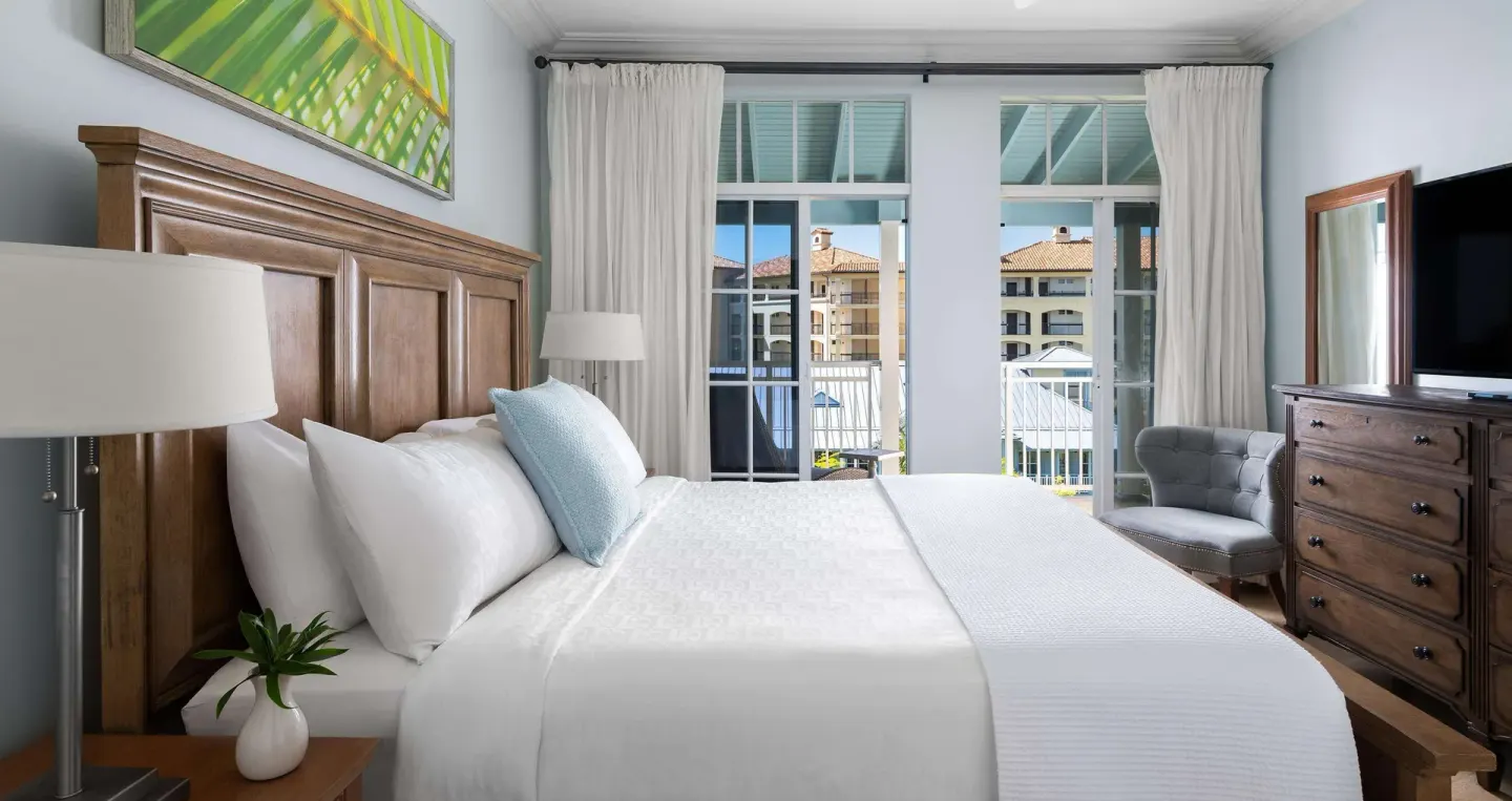 Garden view one-bedroom suite king bed and balcony at Beaches Turks & Caicos.