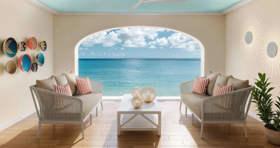 Covered ocean-view terrace with sofas and glass railing at Beaches Turks & Caicos.