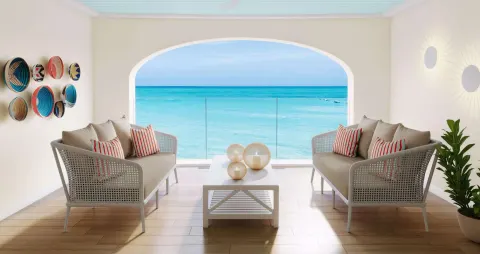 Covered balcony lounge with ocean view at Beaches Turks & Caicos.