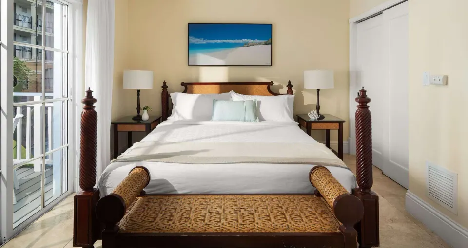 Garden view suite bedroom with four-poster bed at Beaches Turks & Caicos.