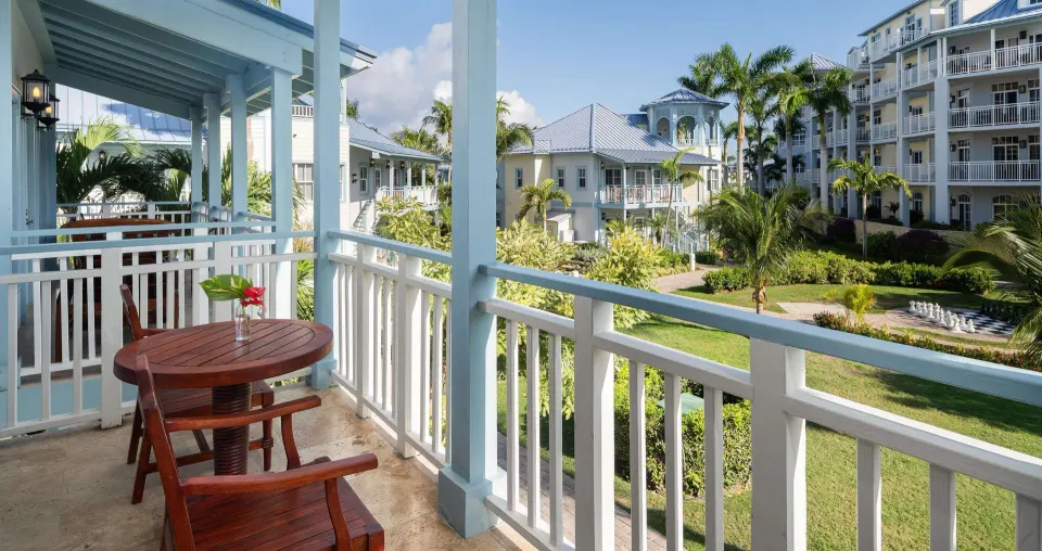 Furnished balcony overlooking gardens at Beaches Turks & Caicos.