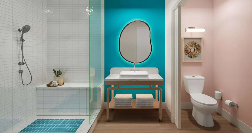 Bathroom in a two-bedroom suite at Beaches Turks & Caicos with glass shower, vanity, and separate toilet area.