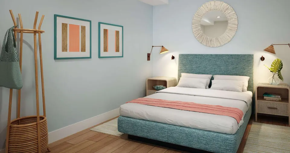 King bedroom in a two-bedroom ocean-view suite at Beaches Turks & Caicos with teal headboard and wall mirror.