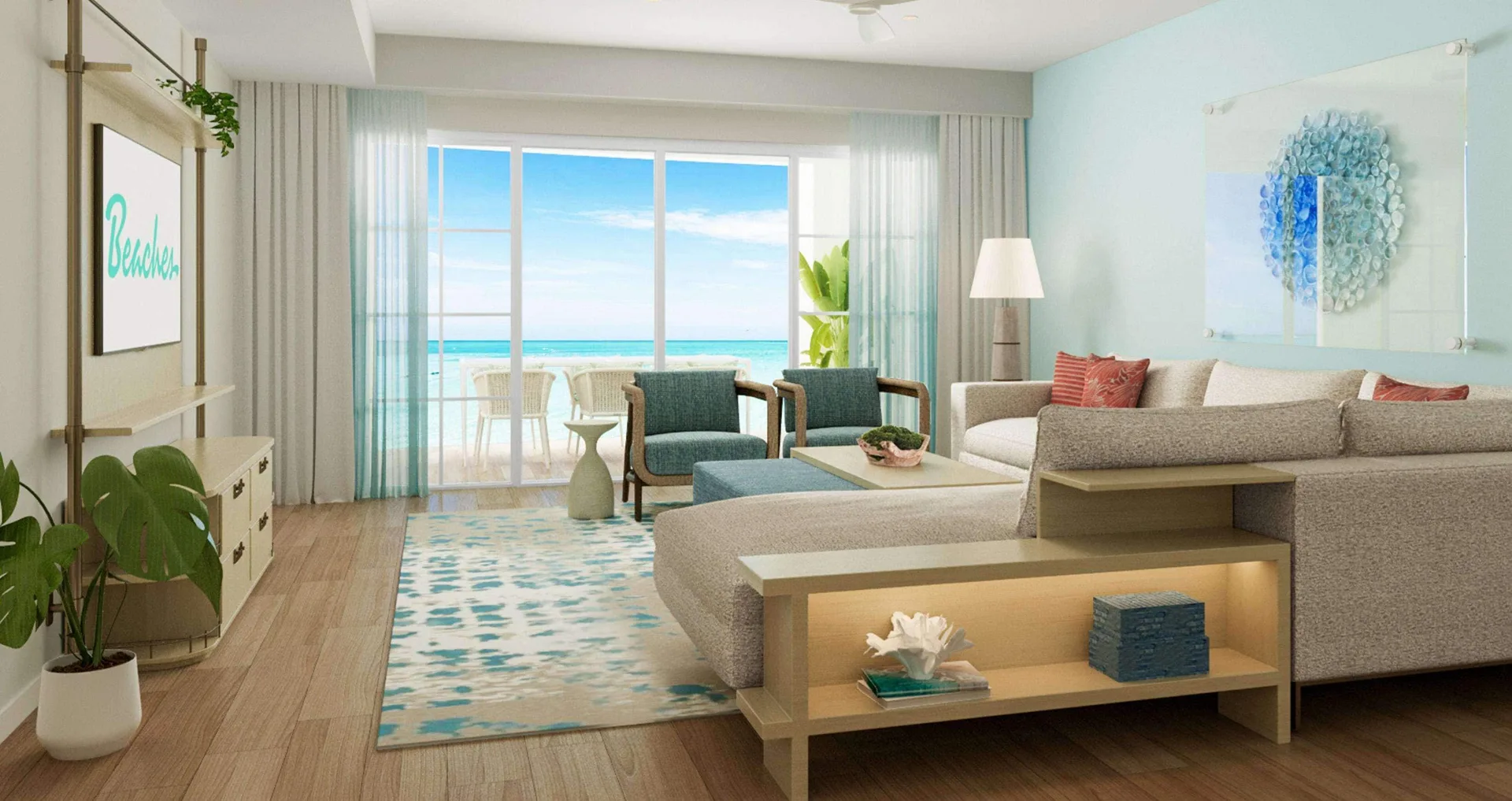 Ocean-view living room in a two-bedroom suite at Beaches Turks & Caicos with sofa and balcony seating.