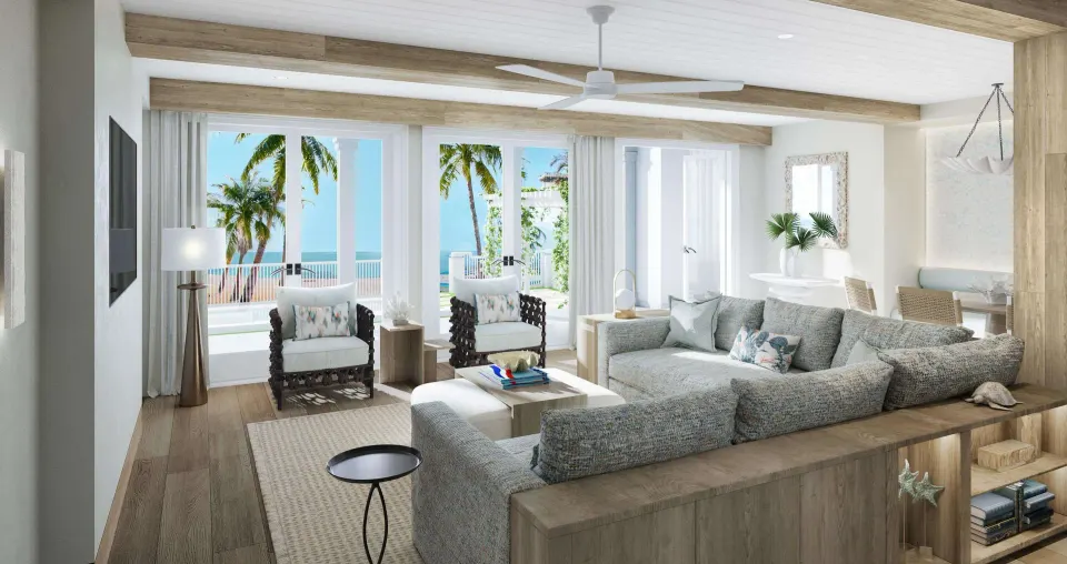 Villa living room with ocean-facing doors at Beaches Turks & Caicos.