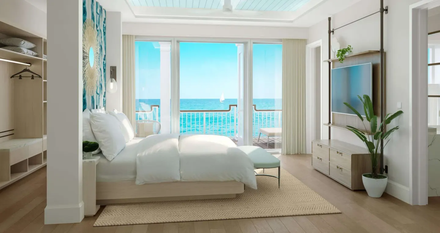 Oceanfront villa king bedroom with balcony at Beaches Turks & Caicos.