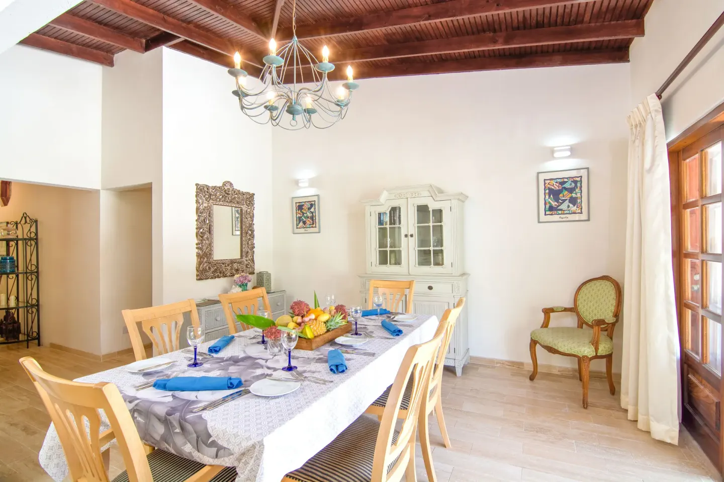 Dining table set in a bright villa-style interior at Bequia Beach Hotel.