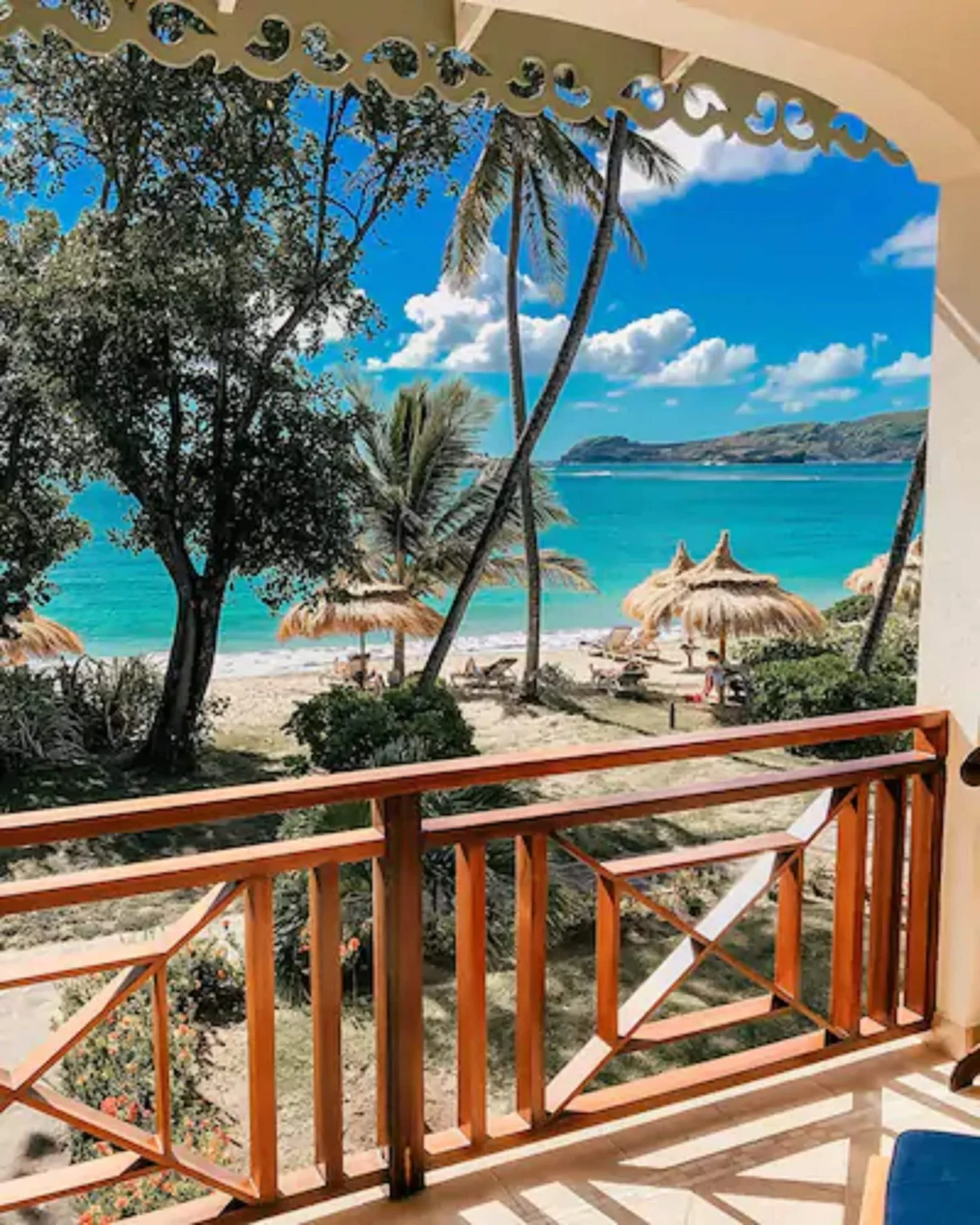 Beachfront Suite balcony view of beach and turquoise sea at Bequia Beach Hotel.