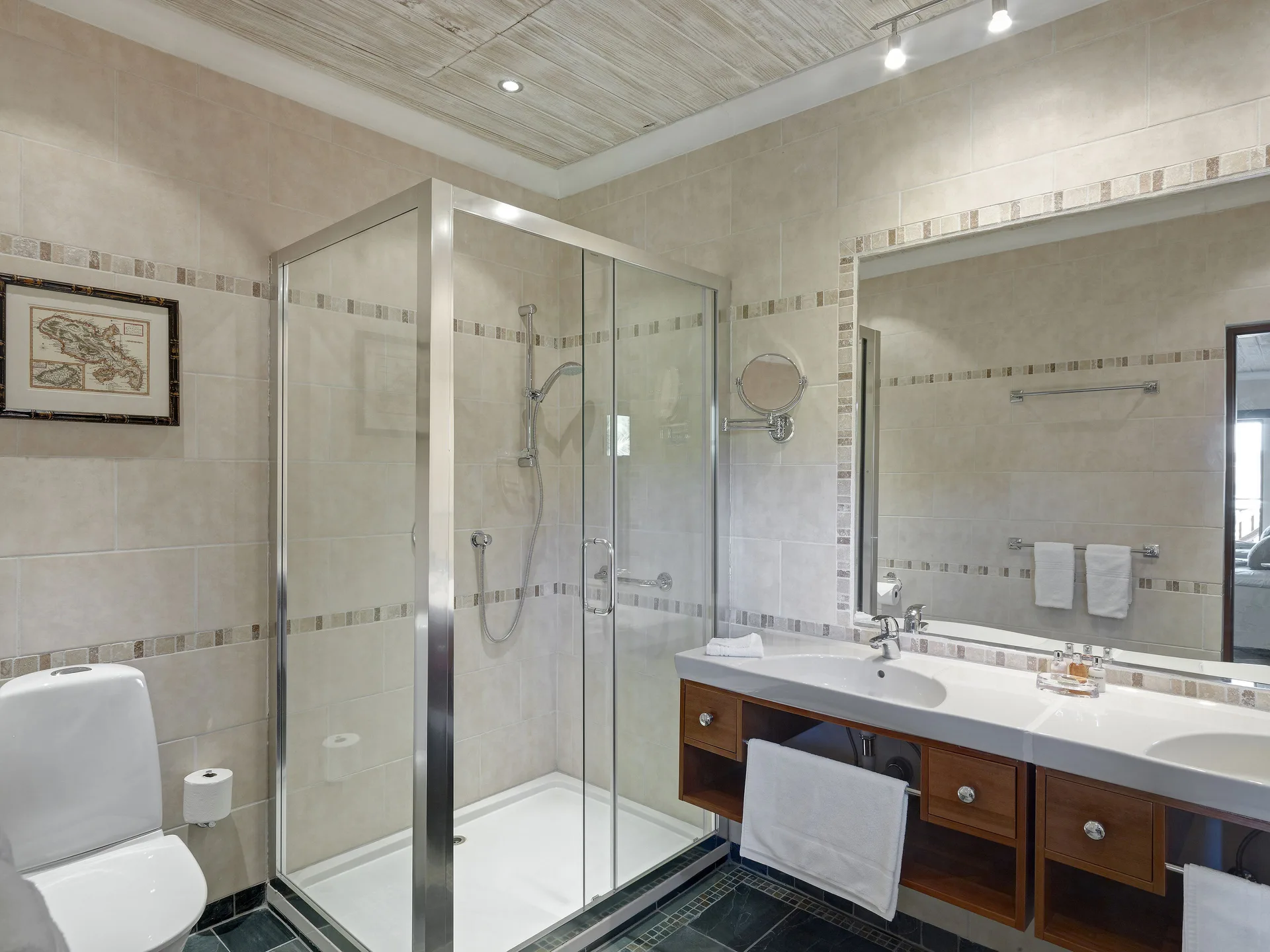Estate Villa bathroom with glass shower and vanity at Bequia Beach Hotel.