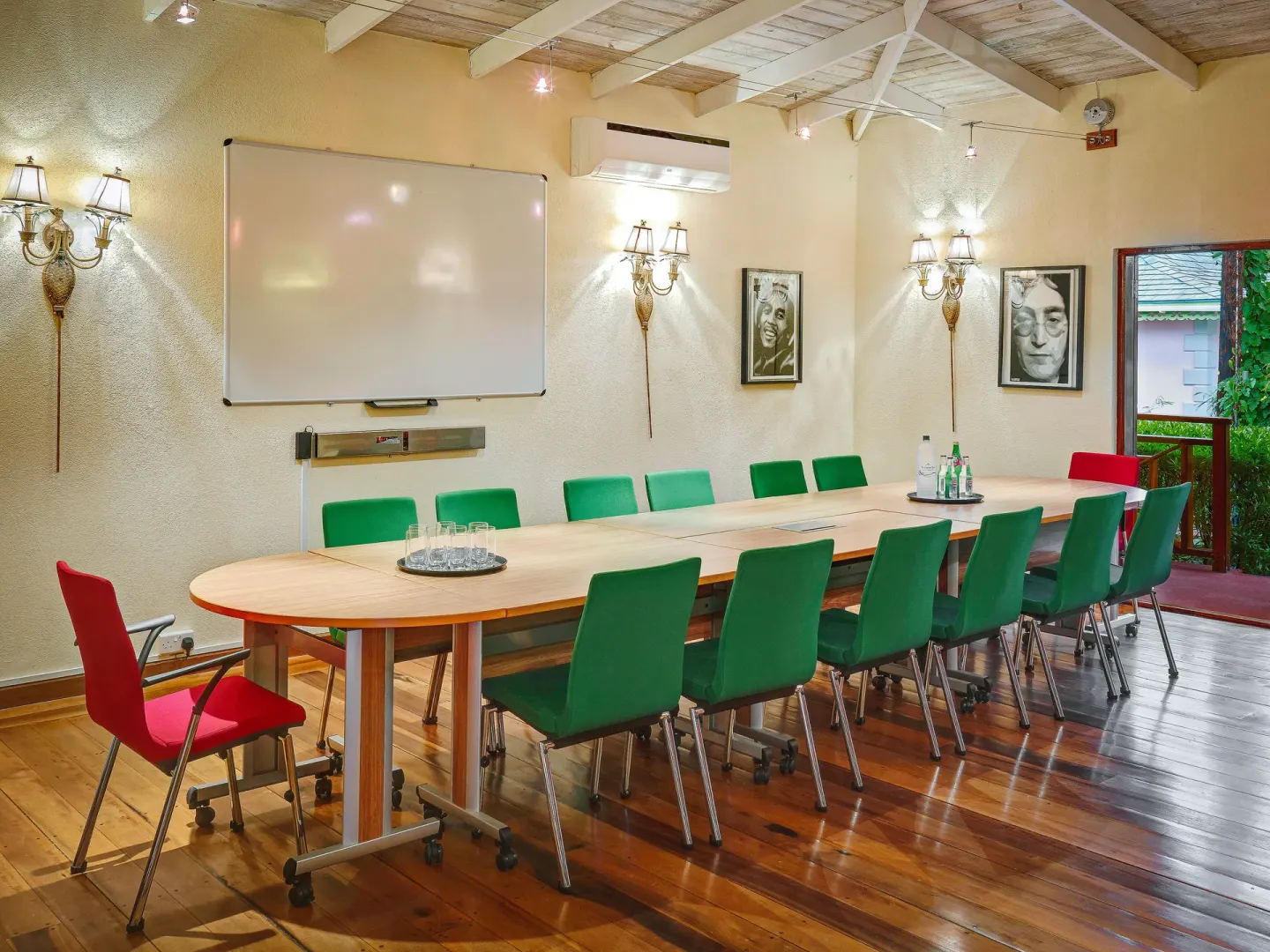 Conference room with long table and whiteboard at Bequia Beach Hotel.