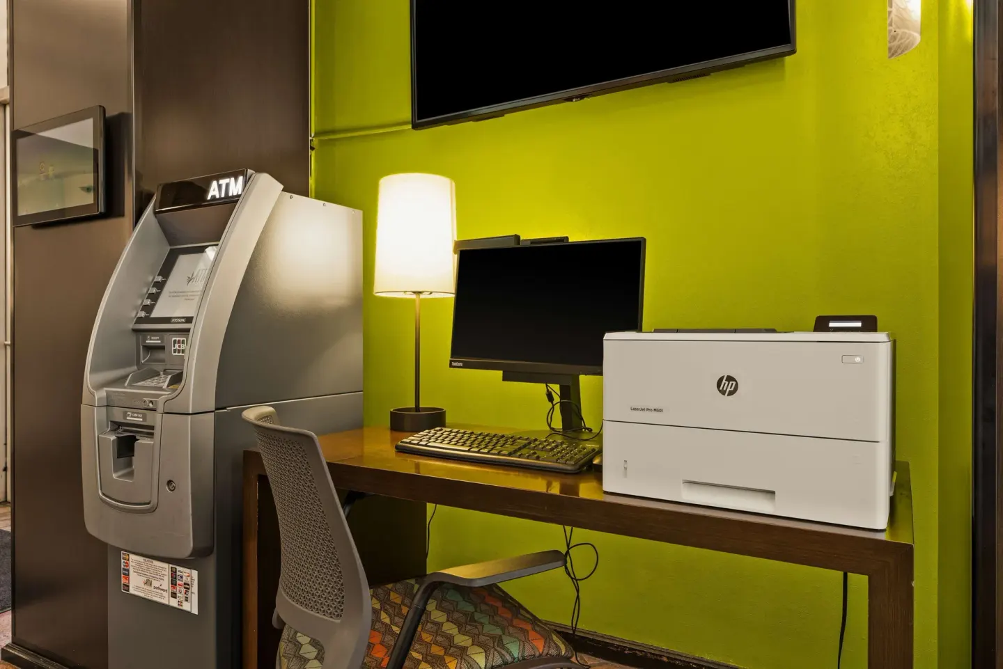 Computer desk, printer, and ATM at Best Western The Plaza Hotel Honolulu Airport.